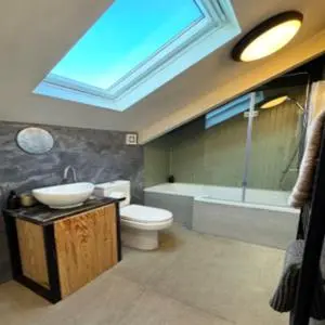 a bathroom with a sink and a toilet and a tub at The Palms Cottage Exclusive Use 3 Bedroom Parking Central Newquay in Newquay