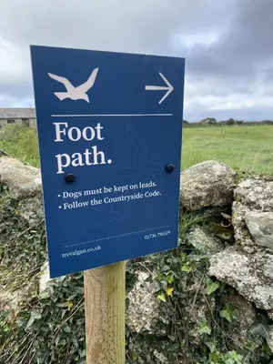 a sign for a foot path in a field at The Granary Couples & Families Retreat Near St Ives, Pet-Free in St Ives