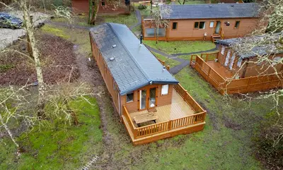 an overhead view of a log cabin with a house at Cabin in the Woods in Saint Erth