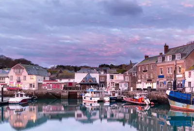 a group of boats are docked in a harbor at Hardys in Padstow