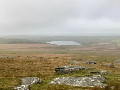 a view from the top of a hill with a lake at The Eliot Cottage in South Petherwin