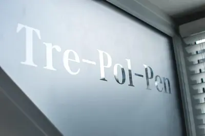a sign for a pizza parlor on a wall at The Attic, Tre-Pol-Pen in St Ives