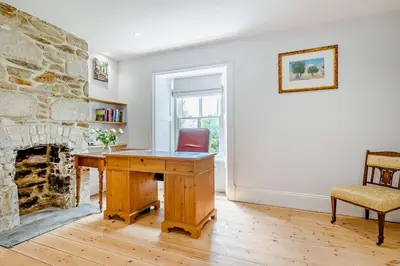 an office with a wooden desk and a fireplace at 5 Bed in Porthleven oc-t24809 in Porthleven