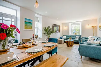 a dining room and living room with a table at 5 Bed in Porthleven oc-t24809 in Porthleven
