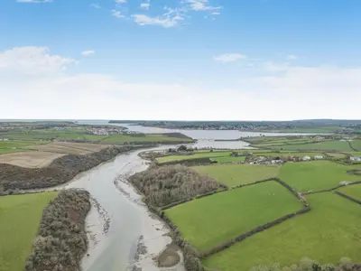 an aerial view of a river in a field at 3 Bed in Wadebridge oc-p34722 in Little Petherick