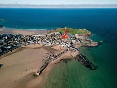 an aerial view of a small island in the ocean at Sealight Cottage in St Ives