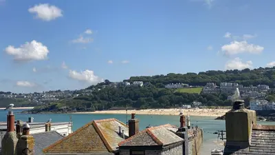 a view of a beach with houses and the ocean at Sealight Cottage in St Ives