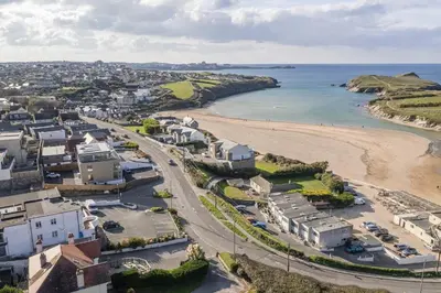 an aerial view of a beach with houses and the ocean at Modern Apartment Opposite Beach Parking & Balcony in Newquay