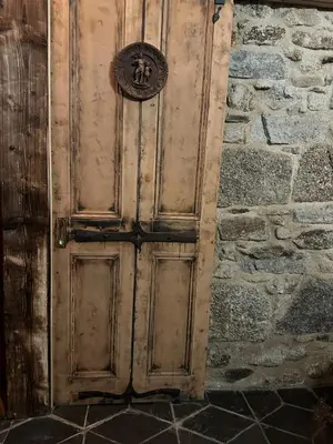 an old wooden door in a stone wall at Tin Miners Captain Georgian hs, parking, Logburner in Camborne