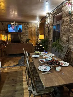 a wooden table with plates of food on it at Tin Miners Captain Georgian hs, parking, Logburner in Camborne