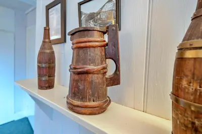 a shelf with two bottles on top of it at Finest Retreats - Millook Water in Poundstock