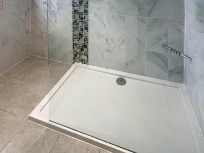 a shower with a white tub in a bathroom at Number 8 in Camborne