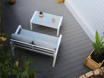 a white chair and a table on a deck at Holiday Home für 1 Personen - 1 Kind ca- 33 m² in Ludgvan- Cornwall by Interhome in Ludgvan