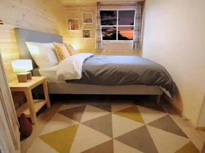 a small bedroom with a bed and a window at Holiday Home für 1 Personen - 1 Kind ca- 33 m² in Ludgvan- Cornwall by Interhome in Ludgvan