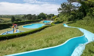 an image of a water park with two pools at Cosy three bedroom holiday home in Parkdean Newquay in Newquay