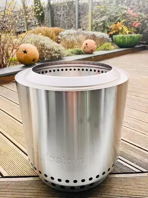 a large metal pot sitting on a wooden deck at Beach Life Cabin Vibes Ocean Views nr Bude in Bude