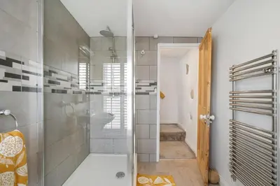 a bathroom with a shower and a sink at Beautiful Cottage Minutes from Mevagissey Harbour in Mevagissey