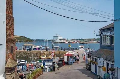 a view of a harbor with boats in the water at Modern Townhouse in Central Falmouth Nr Seafront in Falmouth