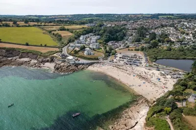 an aerial view of a beach with a group of people at Modern Townhouse in Central Falmouth Nr Seafront in Falmouth