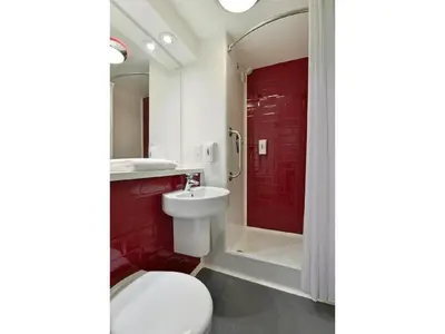a bathroom with a toilet and a sink and a shower at Travelodge Wadebridge in Wadebridge