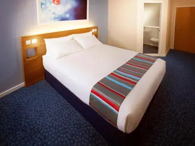 a bedroom with a large bed in a hotel room at Travelodge Wadebridge in Wadebridge