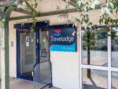 a truckobe store with a sign on the front of it at Travelodge Bodmin Roche in Roche