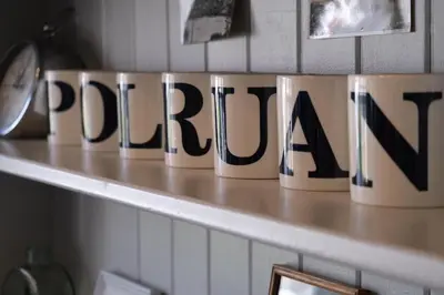a sign that reads pretoria sitting on a shelf at Beautiful Cottage on the Water Front Polruan in Polruan