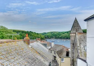a view of the water from the roofs of buildings at Sundance Cottage Central Fowey with Sea Views in Fowey