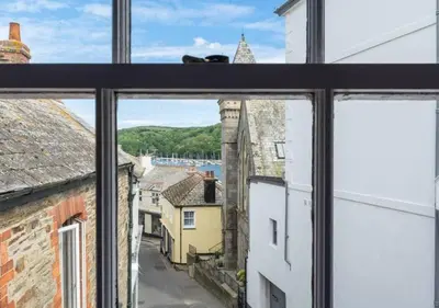 a view of a city from a window at Sundance Cottage Central Fowey with Sea Views in Fowey