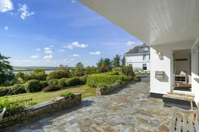 an external view of a house with a stone walkway at Spacious Apartment in Rock Private Parking in Roche