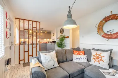 a living room with a gray couch with pillows at 2 Bed in Carbis Bay oc-h34810 in Carbis Bay