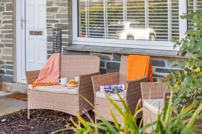 a porch with two chairs with towels on them at 2 Bed in Carbis Bay oc-h34810 in Carbis Bay
