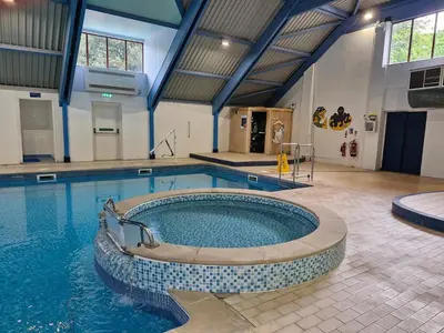 a large swimming pool in a building at St Minver Hideaway in Saint Minver