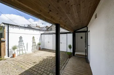an internal view of a garage with a wooden ceiling at Beautiful Home in Heart of Truro in Truro