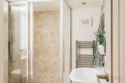 a bathroom with a shower and a sink at Romantic Converted Barn Perfect St Agnes Location in St. Agnes