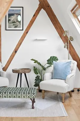 a living room with two chairs and a table at Penthouse Apartment with Sea Views Falmouth in Falmouth
