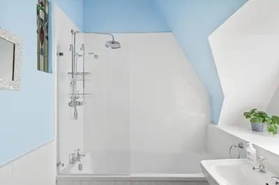 a bathroom with a shower and a sink at Penthouse Apartment with Sea Views Falmouth in Falmouth