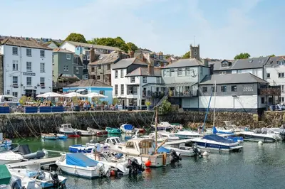 a group of boats are docked in a harbor at Penthouse Apartment with Sea Views Falmouth in Falmouth