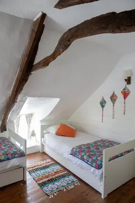 two beds in a attic room with kites on the wall at Old Cottage 1 min from the sea! Crackington Haven in Crackington Haven