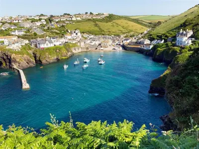 a group of boats in a body of water at Harbour Loft Port Isaac harbour beach views in Port Isaac