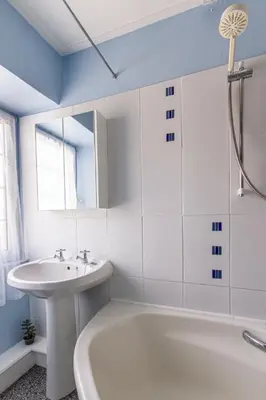 a bathroom with a white tub and a sink at Fourways near the golden sands of Marazion in Leedstown
