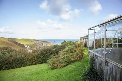 a view of the ocean from a house at Silvershell lovely views across Port Isaac in Port Isaac