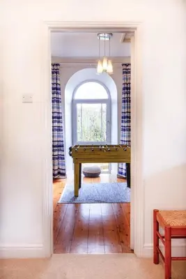 a hallway with a pool table in a house at Organ Loft North Coast moorland on the doorstep in Saint Breward