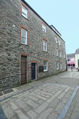 a brick building with a door on the side of it at The Loft in Wadebridge