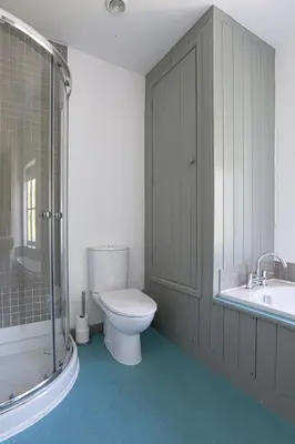 a bathroom with a toilet and a sink and a tub at Coastguard Cottage - set in an elevated position with fabulous views overlooking Portloe in Portloe