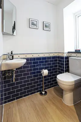 a bathroom with a toilet and a sink at Trekenna close to Marazion and Praa Sands in Saint Hilary