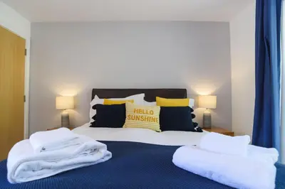 a bedroom with a bed with white towels on it at Trewhiddle Cottage 41 - 1 Bed Ensuite in St Austell