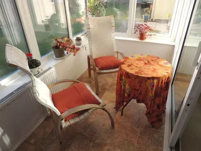 a room with a table and two chairs and a table with at Oxencombe in Davidstow