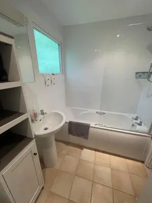 a bathroom with a white tub and a sink at Villa 19 Lanteglos 2 bed sleep 5 in Lanteglos