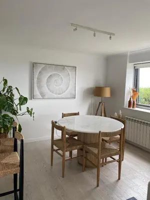 a dining room with a table and chairs at Stunning Sea View Apartment in Falmouth